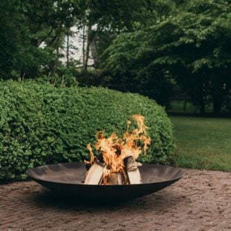 Corten steel fire bowl round on the terrace