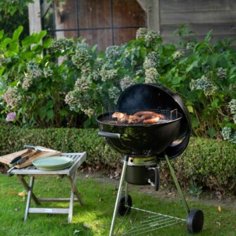 Kettle 57 plus coal barbecue in garden 03