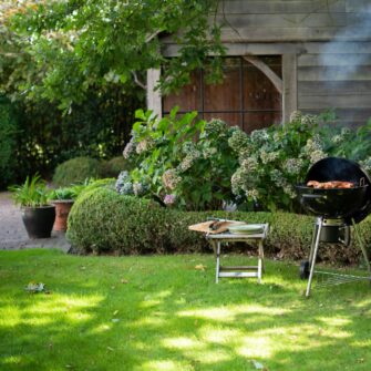 Kettle 57 plus coal barbecue in garden kl